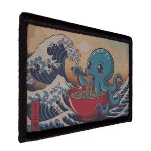 May include: A rectangular patch with a cartoon octopus enjoying ramen, set against a backdrop of a stylized ocean wave. The patch has a black border and a vintage aesthetic.