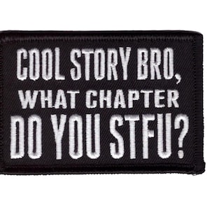 May include: Black rectangular patch with white embroidered text. The text reads "COOL STORY BRO, WHAT CHAPTER DO YOU STFU?" The patch has a black border and is likely an iron-on or sew-on patch.