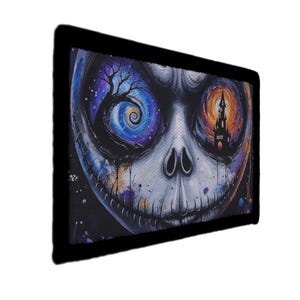 May include: A rectangular art print depicting a stylized skull with swirling galaxy eyes and a stitched mouth. One eye shows a tree in a spiral, the other a castle. The artwork is framed in black and has a Halloween theme.