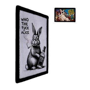 May include: A rectangular wall art piece featuring a black and white illustration of a rabbit smoking a cigarette and holding a bottle of whiskey, with the text WHO THE FUCK IS ALICE. A smaller, colorful version of the same graphic is shown above.
