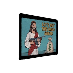 May include: Pop art style patch featuring a smiling figure holding a machine gun, with the text "LET'S GET THIS DAILY BREAD." A money bag with a dollar sign is also visible. The image has a black border and a blue background.