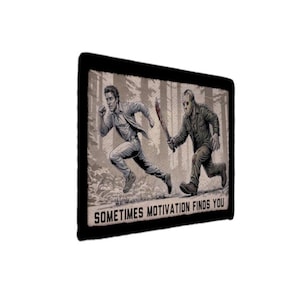 May include: A black patch with a grayscale illustration of a man running from a figure with a mask and a bloody machete. The text "SOMETIMES MOTIVATION FINDS YOU" is at the bottom of the patch.