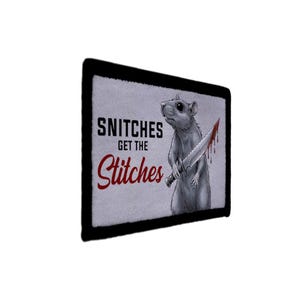 May include: Rectangular patch with a black border. It features a gray rat holding a bloody knife. The text "SNITCHES GET THE Stitches" is displayed in black and red font on a light gray background.