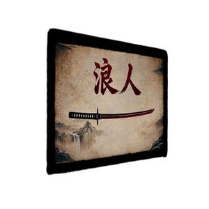 May include: A rectangular wall art piece with a black border. The artwork features a Japanese kanji symbol in red above a katana sword with a red blade. The background has a vintage, textured appearance with a waterfall scene.