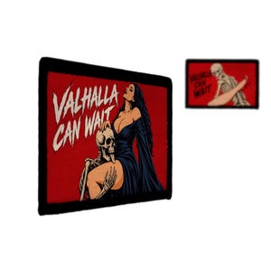 May include: A rectangular patch with a black border featuring a red background, a person with long dark hair in a dark dress, and a skeleton. The text "VALHALLA CAN WAIT" is printed in white. A smaller version of the same design is also shown.
