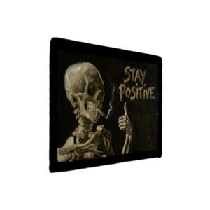 May include: A rectangular wall art piece featuring a painting of a human skeleton with a cigarette in its mouth, giving a thumbs-up gesture. The text "STAY POSITIVE" is written in gold lettering against a dark background, framed in black.