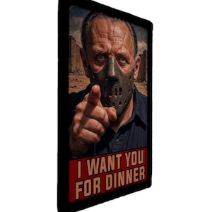 May include: A rectangular metal sign featuring a portrait of a man wearing a Hannibal Lecter mask, pointing at the viewer. The sign has the text "I WANT YOU FOR DINNER" in red letters on a black background.