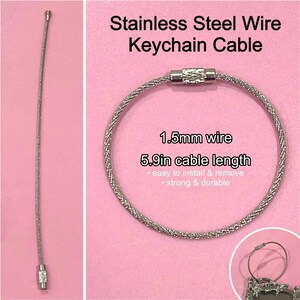 May include: A stainless steel keychain cable, 15 cm long, with a 1.5mm wire. The silver cable has a braided design. The image text states it is easy to install and remove, and strong and durable.