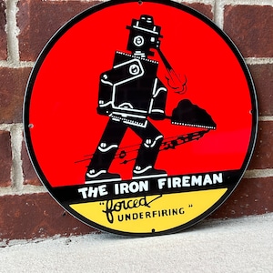 The iron fireman coal burner heavy steel vintage style Metal sign