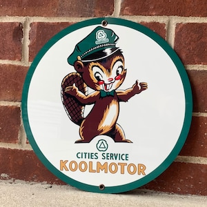 KOOLMOTOR cities service metal sign