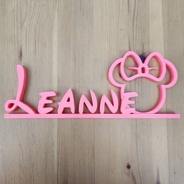 3d printed Disney style font with Minnie Mouse outline plastic name plate