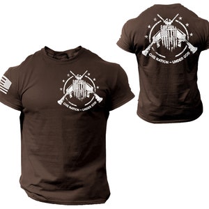 May include: Brown t-shirt with a white graphic of two crossed rifles with an American flag in the center. The graphic is surrounded by a circle of stars and the text "One Nation - Under God".