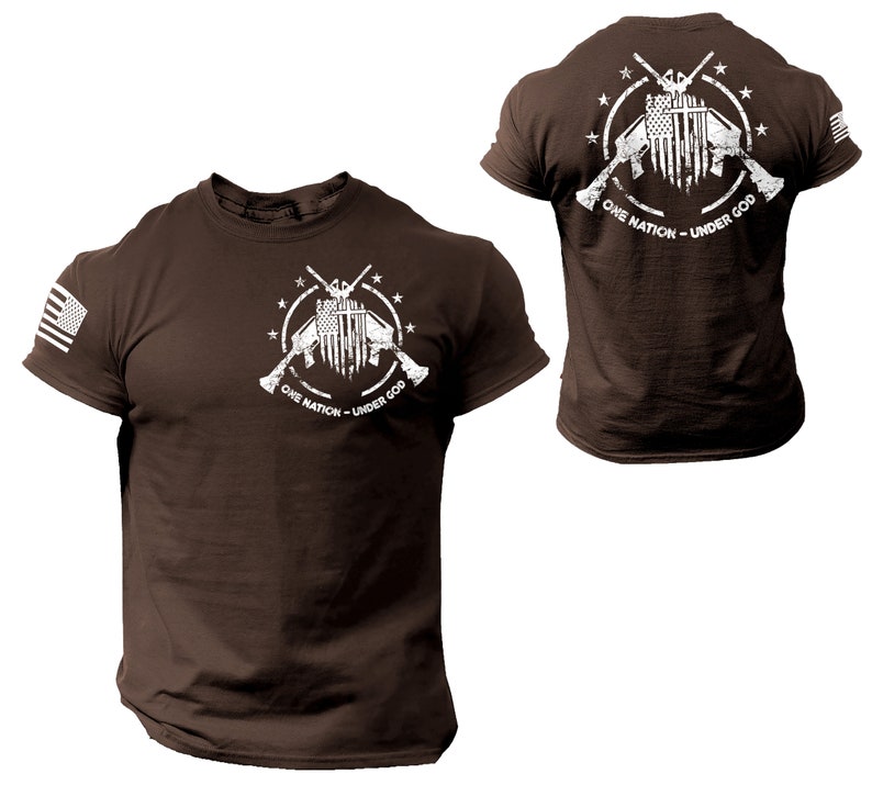 May include: Brown t-shirt with a white graphic of two crossed rifles with an American flag in the center. The graphic is surrounded by a circle of stars and the text "One Nation - Under God".