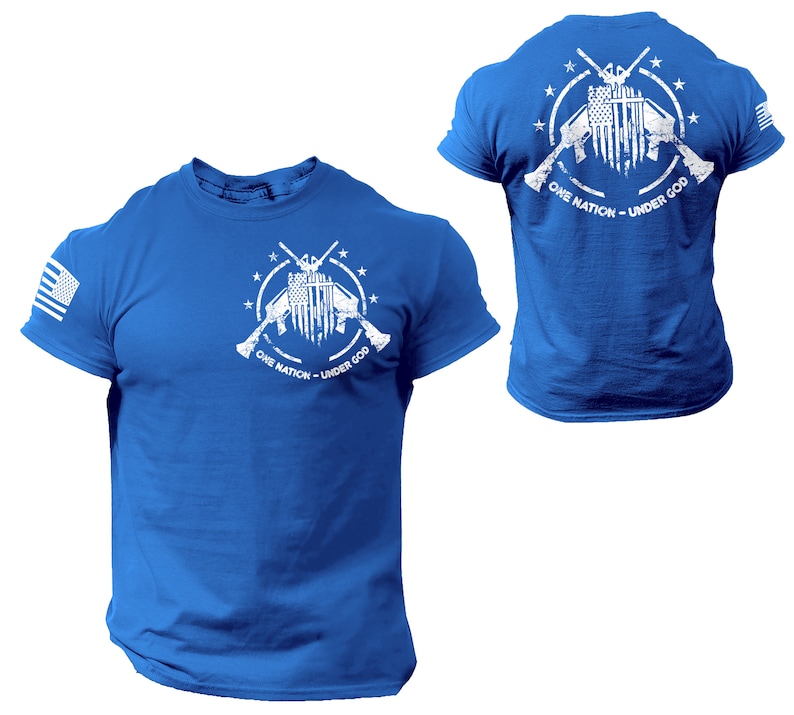 May include: A royal blue t-shirt with a white graphic of crossed rifles with an American flag in the center. The graphic is surrounded by stars and the text "One Nation - Under God".