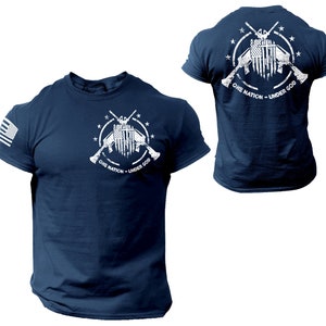 May include: Navy blue t-shirt with a white graphic of crossed rifles and an American flag with the text "One Nation - Under God".