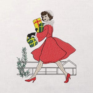 May include: Embroidered image of a woman in a red coat and red heels carrying wrapped gifts. The woman has a white fur collar and hat. The gifts are yellow and green with gold ribbon. A small evergreen tree and a fence are in the background.