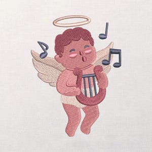 May include: Embroidered image of a cherubic angel playing a harp, surrounded by musical notes. The angel has pink skin, hair, and a halo, with beige wings and a white garment. The harp is a darker pink with blue strings.