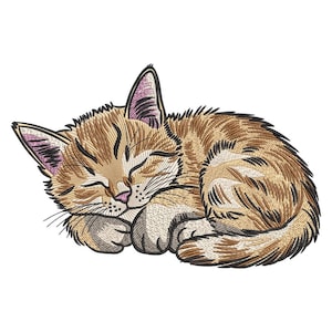May include: An embroidered design of a sleeping kitten. The kitten is curled up, with its eyes closed and paws tucked in. The cat has brown and tan fur with black stripes and pink ears and nose. The background is white.
