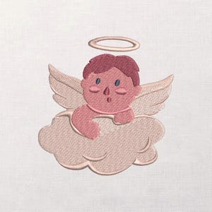 May include: Embroidered design of a cherubic angel with a halo, wings, and a cloud. The angel has a surprised expression, with blue eyes and a pink complexion. The design is in shades of pink and beige.