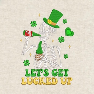 May include: Embroidered design of a skeleton in a green top hat, drinking from a green bottle. The design includes shamrocks, gold stars, and the text "LET'S GET LUCKED UP" in green and gold.