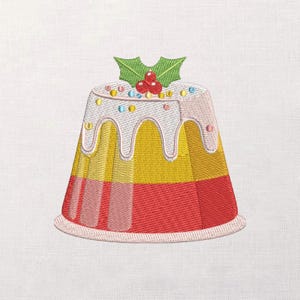 May include: Embroidered Christmas pudding with red, yellow, and white layers, topped with white icing, colorful sprinkles, and a sprig of holly with red berries. The pudding has a round base and a conical shape.