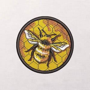 May include: Embroidered patch featuring a detailed bee design. The bee has yellow and black stripes, with white-tipped wings, set against a yellow honeycomb background. The patch is circular, framed by a black border, and is suitable for clothing or accessories.