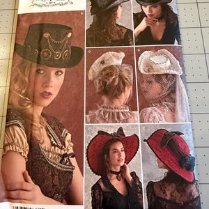 May include: A Simplicity 8361 sewing pattern envelope featuring illustrations of four distinct hat styles. The designs include a dark top hat with chain accents, a white hat with a veil, and a wide-brimmed red hat with black lace and bow details.