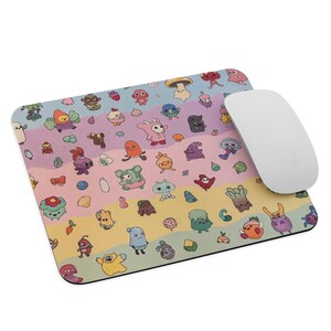 May include: A rectangular mousepad with a colorful, whimsical design featuring various cartoon creatures and a white computer mouse. The mousepad has a rainbow striped background with a variety of cute characters.