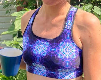 Sports bra with sacred geometry fractal flower art for yoga, festival clothing, running or active sports. Blue pink purple and white.