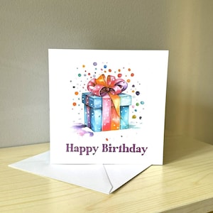 Cartão de feliz aniversário com presente em aquarela