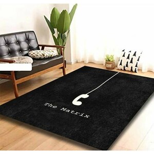 Puede incluir: Alfombra en blanco y negro con un auricular de teléfono y el texto "The Matrix" sobre un fondo negro.