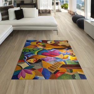 May include: A colorful abstract rug with geometric shapes and figures in shades of blue, green, red, yellow, and brown. The rug is laid out on a light wood floor in a modern living room.