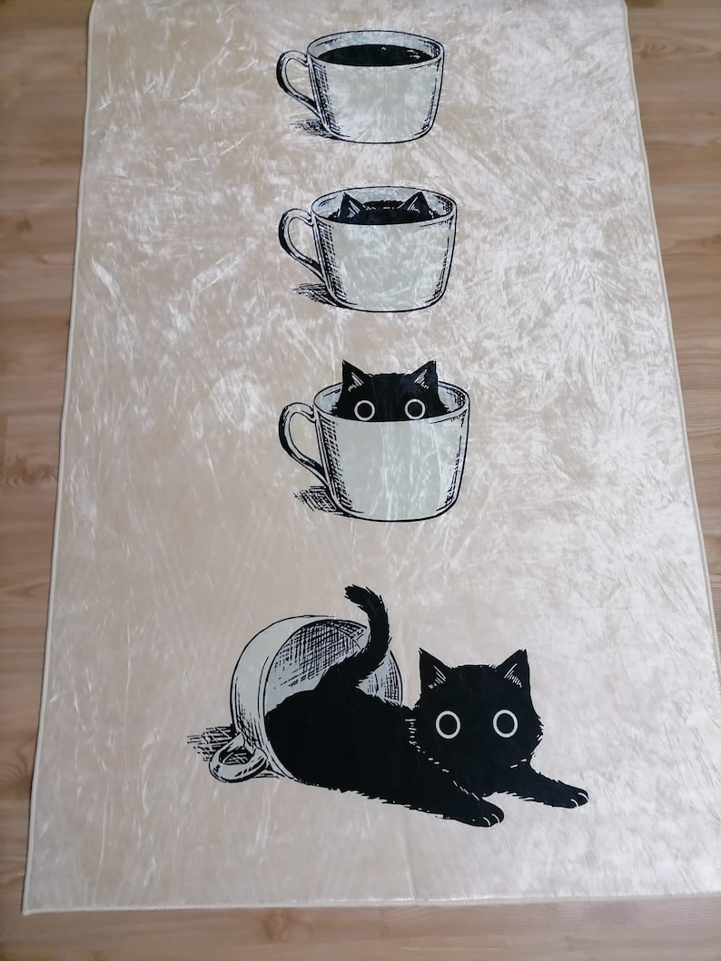 May include: A white background with a black cat peeking out of a coffee cup. The cat is in three different stages of emerging from the cup, starting with just its head, then its head and shoulders, and finally the whole cat is out of the cup.