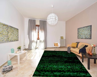 May include: A living room with a beige couch, a white coffee table, and a green and black rug with a code-like pattern. The rug is in the center of the room and is surrounded by furniture.