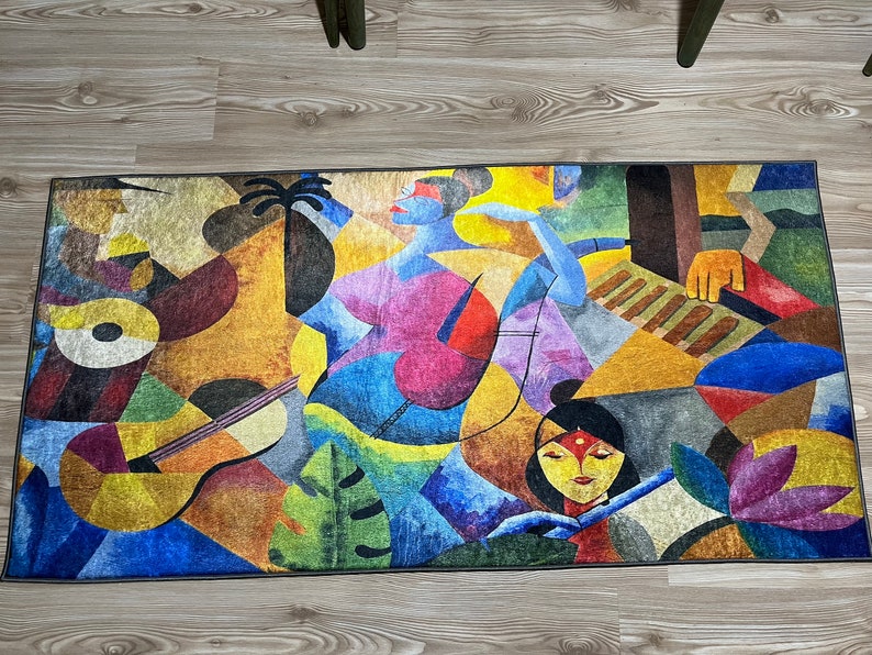 May include: Abstract rug with a colorful design featuring two figures, one playing a musical instrument and the other holding a flower. The rug has a geometric pattern with shades of blue, yellow, red, green, and brown.