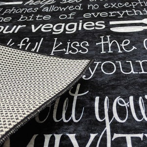May include: Black and white kitchen rug with the text "Help yourself, no cell phones allowed, no exceptions, try one bite of everything, eat your veggies, kiss the cook, but your day"