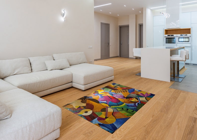 May include: A white sectional sofa with a colorful abstract rug featuring musical instruments and figures. The rug has a vibrant mix of yellow, blue, red, green, and pink colors.