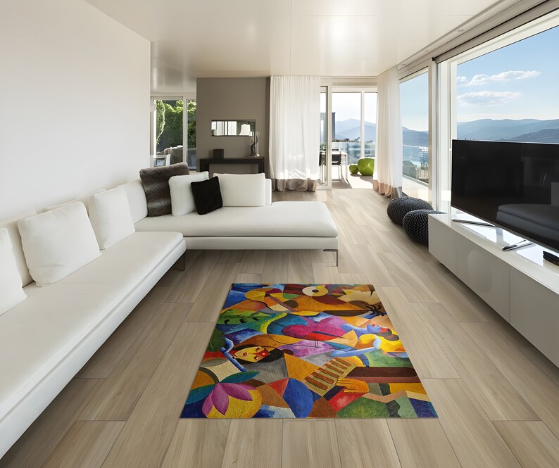 May include: A colorful abstract rug with geometric shapes and figures in shades of blue, green, red, yellow, and brown. The rug is laid out on a light wood floor in a modern living room.
