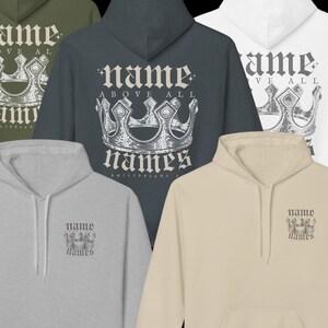 May include: Five different color hoodies with a crown and the text "name above all names Philippians 2:9" printed on them.