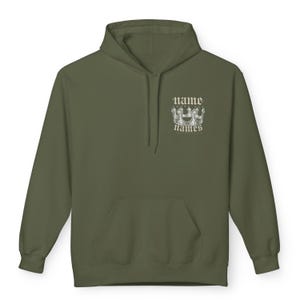 May include: A green hooded sweatshirt with a white graphic of a crown and the text "name above names" on the front.