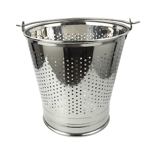 May include: A stainless steel colander with a handle, featuring a perforated design. The colander is ideal for straining liquids from food.