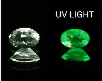 Natural Daylight Fluorescent Hyalite Opal 0.14 Carat 4.5x3 MM Oval Shape Faceted Gemstone