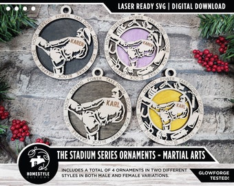 May include: Four laser-cut wooden ornaments featuring a martial arts figure in a fighting pose. The ornaments are in two different styles, with a male and female version of each. The ornaments are labeled with the words "KAREN" and "KARL". The text "THE STADIUM SERIES ORNAMENTS - MARTIAL ARTS" is at the bottom of the image.