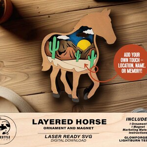 May include: A layered wooden horse ornament and magnet featuring a desert landscape scene. The horse is light brown with a cutout revealing a desert scene with cacti, mountains, and a setting sun. The text on the image says "Layered Horse Ornament and Magnet".