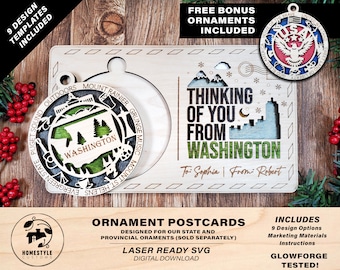 May include: A laser cut wooden ornament postcard with a design featuring the state of Washington. The postcard says "Thinking of you from Washington" and has space for a personalized message. The ornament is designed to be used as a Christmas ornament or a postcard.