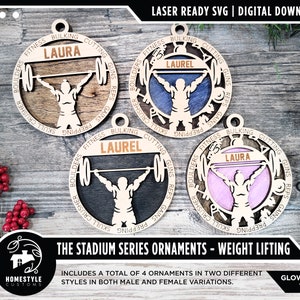 May include: Four laser-cut wooden Christmas ornaments featuring a weightlifter silhouette with the words "Fitness, Bulking, Cutting, Guns, Reps, Gains, Prepping, Skull Crusher, and Boulders" around the edge. The ornaments are in four different colours: brown, black, blue, and pink. The text "The Stadium Series Ornaments - Weight Lifting" is at the bottom of the image.