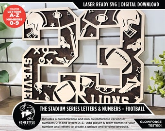 May include: A laser-cut wooden design of the number 23 with football-themed elements. The number is brown with a wood grain texture. The design includes a football, helmet, and other football-related imagery. The text "STEVIE" and "LIONS" is included in the design. The text "THE STADIUM SERIES LETTERS & NUMBERS - FOOTBALL" is at the bottom of the image.