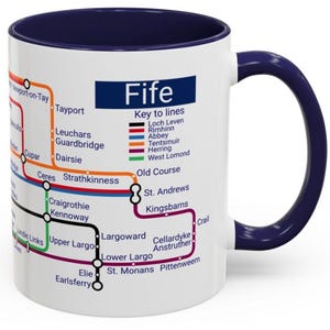 May include: White ceramic mug with a navy blue interior and handle. The mug displays a colourful map of Fife, Scotland, with various locations and lines labelled. The word "Fife" is displayed prominently.