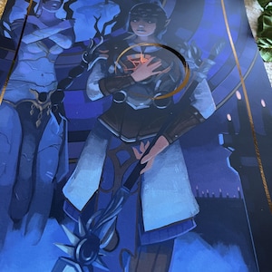 May include: A blue and gold fantasy art print featuring two figures, one with a sword and the other with a staff. The background is a dark blue with a gold border.