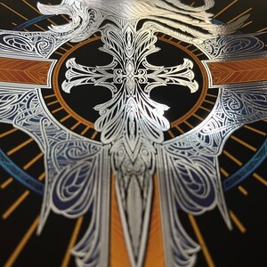 May include: A silver lion's head with a mane and a silver cross with intricate details on a black background with gold and blue accents.